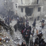 Residents look for survivors at a damaged site after what activists said was an air strike from forces loyal to Syria’s President Bashar al-Assad in the Karam Al-Beik area of Aleppo